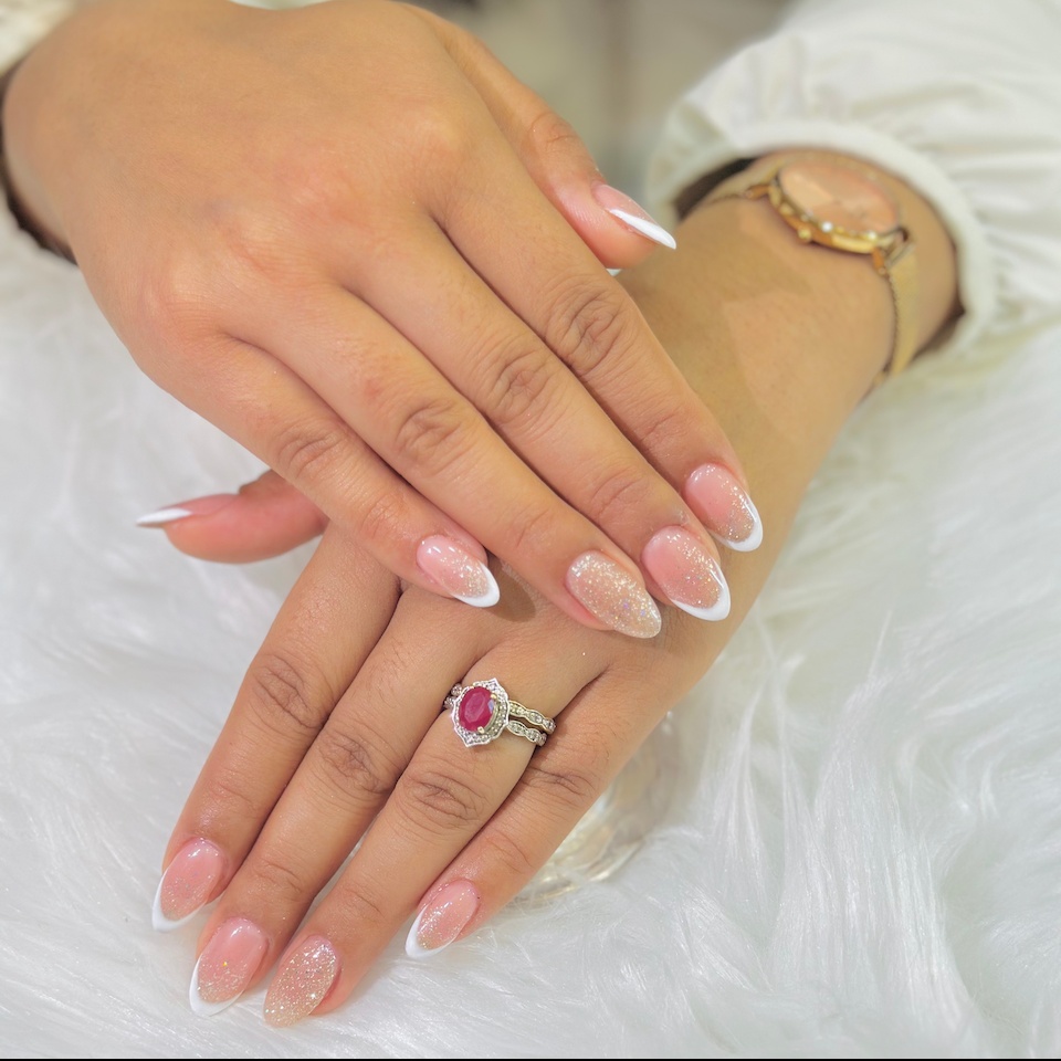 Almond shaped nails in nude colour with white French tip using builder gel